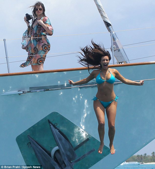 Thrill-seekeer! Kim was seen launching herself off the side of the boat and into the sea while her sister Khloe stood behind her