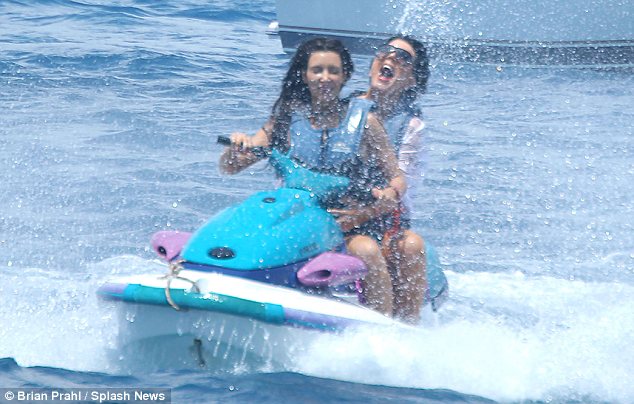 The reality star also got onto a jetski with her mother Kris and was seen cutting up some waves in the sea