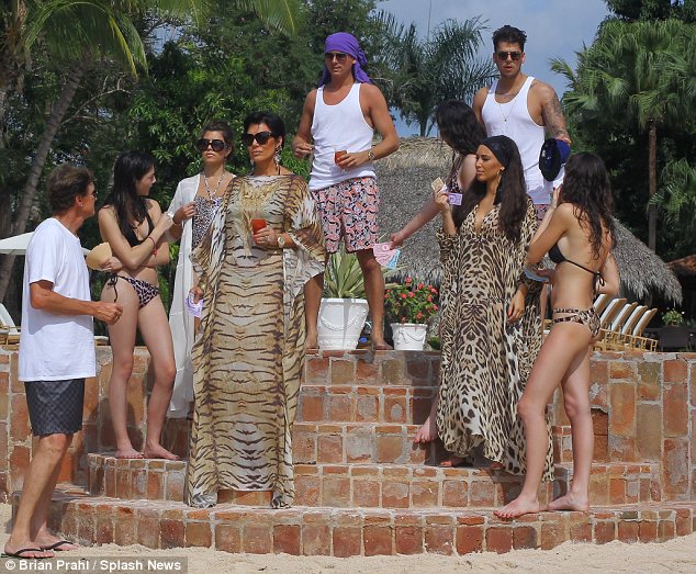 Kim was seen with her mother Kris, stepfather Bruce, sisters Kourtney, Kylie and Kendall, Kourtney's boyfriend Scott and her brother Robert as they posed for a family picture on some steps