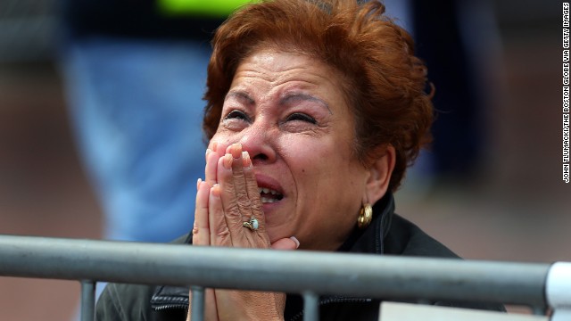 A woman kneels and prays at the scene of two apparent bombings near the finish line of the Boston Marathon on Monday, April 15. &lt;a  data-cke-saved-href='http://www.cnn.com/2013/04/15/us/boston-marathon-explosions/index.html' href='http://www.cnn.com/2013/04/15/us/boston-marathon-explosions/index.html'&gt;Read our developing news story&lt;/a&gt; and follow up-to-the-minute reports &lt;a  data-cke-saved-href='http://news.blogs.cnn.com/2013/04/15/explosions-near-finish-of-boston-marathon/' href='http://news.blogs.cnn.com/2013/04/15/explosions-near-finish-of-boston-marathon/'&gt;on CNN.com's This Just In blog&lt;/a&gt;.